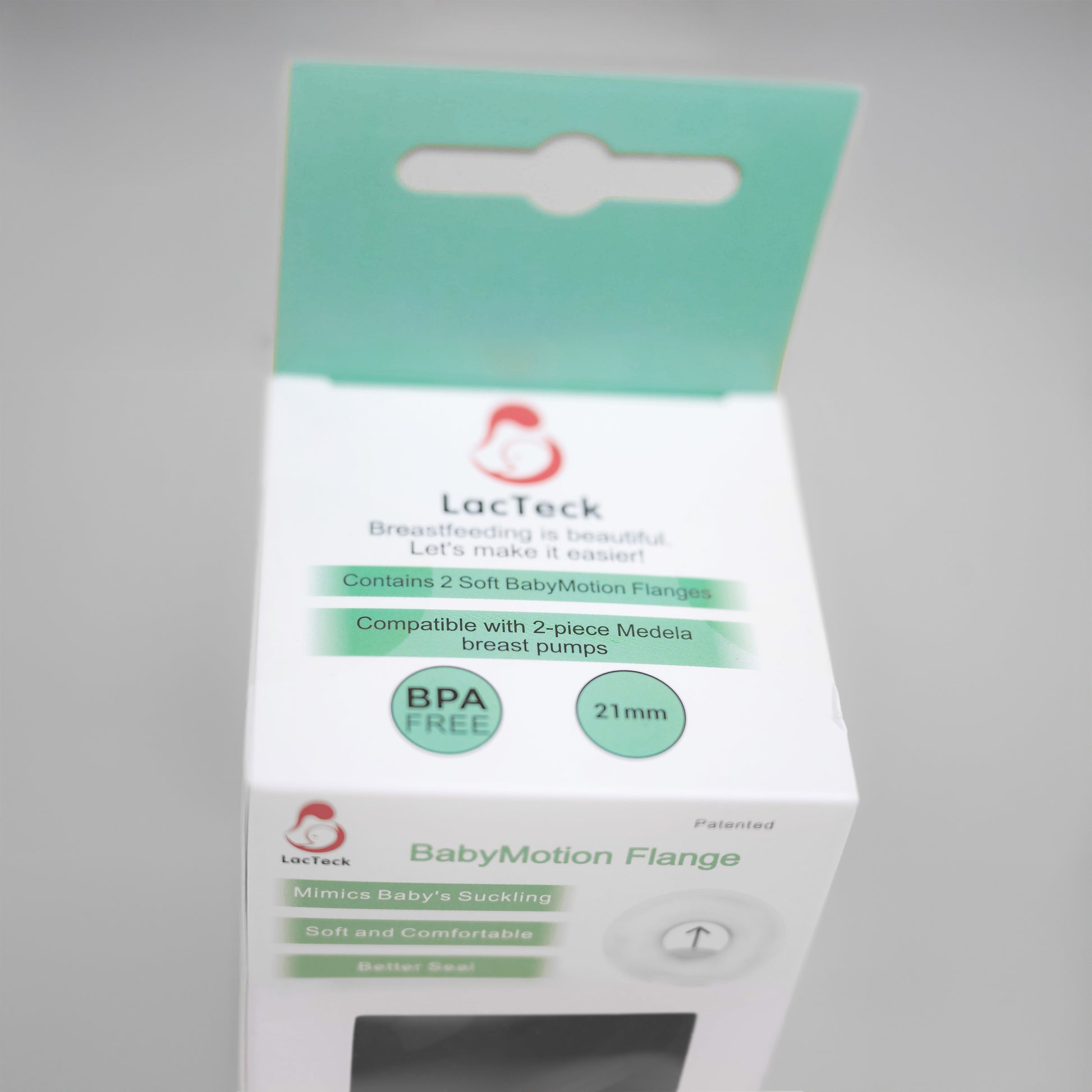A pair of LacTeck soft silicone breast pump flanges sizes 12mm-27mm shown in product packaging.