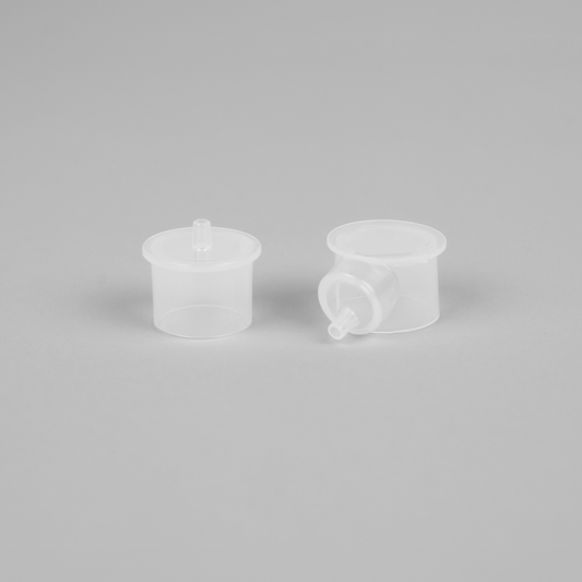 Close-up of LacTeck SleepyMommy Adapter showing precise connectors between flange and bottle adapter for secure and efficient breast pumping.