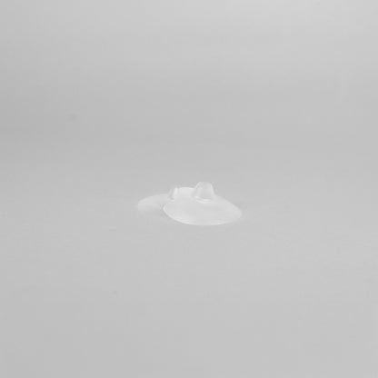 Nipple shield with open tip allowing mother’s nipple to contact baby’s mouth for natural breastfeeding transition